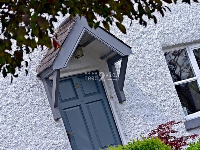 The welcoming front door of the cottage, setting the tone for what is to come.