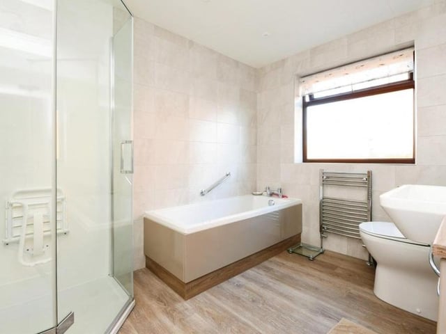 The bright family bathroom, complete with bath and shower cubicle, is finished to the standard you would expect from a £500,000 property.
