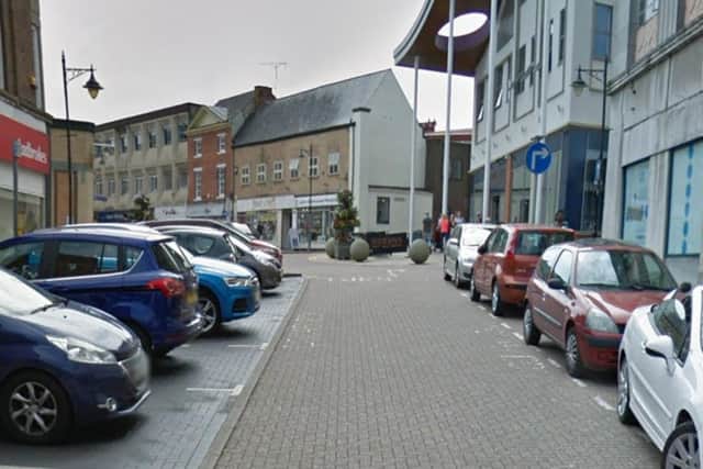 The man was pushed up Queen Street against his will before being robbed.