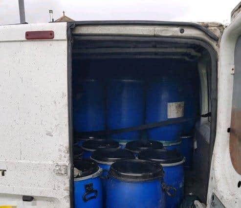 The van with barrels of oil.