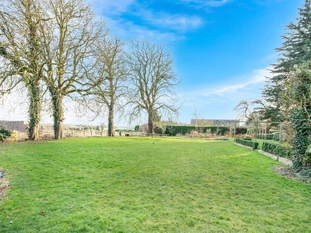 The property benefits from a private, gated driveway leads to substantial off road parking, a detached garage, and further outbuilding currently utilised as a workshop/ storage, with annexe or stable block potential. Fully enclosed, and resting upon approximately 0.75 acres, the green grounds comprise of several lawns, well established trees and planting, outdoor store, pigpen, sheltered seating area, greenhouse, vegetable patches, outdoor tap and external wall mounted lighting.