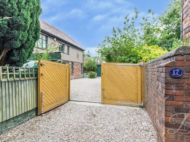 Returning to the front of the house, a gated entrance leads on to a gravelled driveway.