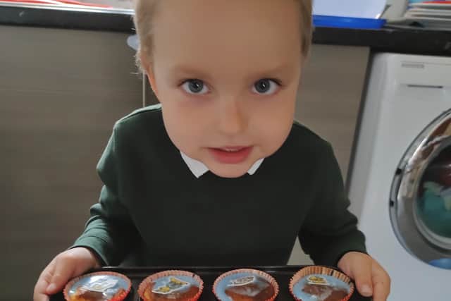 Four-year-old Jack with his cakes.