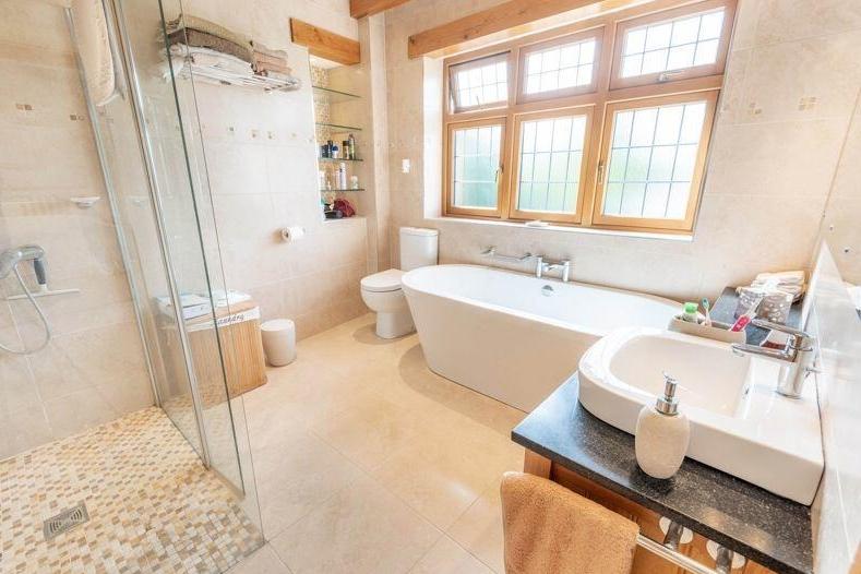Better bathtimes are guaranteed in this sleek suite, which features bath, shower cubicle, low-flush WC and hand wash basin..