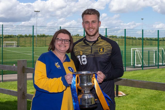 Cheryl Foulkes hands over the Stags Supporters Association Player of the season, voted for by its members, to winner Rhys Oates.