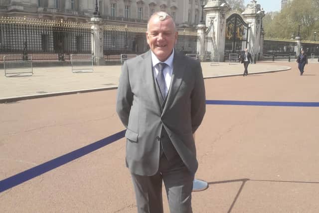 Bus driver Dennis Dutton at Buckingham Palace.