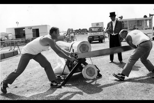 The Adams Lumberjacks try to beat a record for cutting a log the fastest at Southsea Show in 1989. The News PP4116