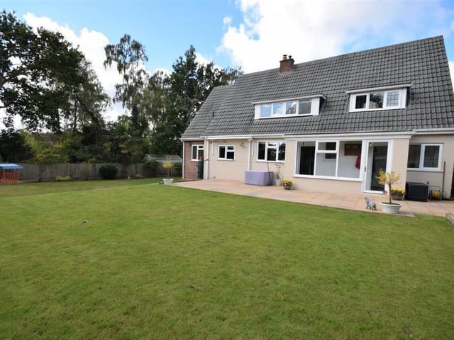 The house sits on a substantial plot, which includes a generously-sized lawn at the back. The rear garden enjoys a private and sheltered setting.