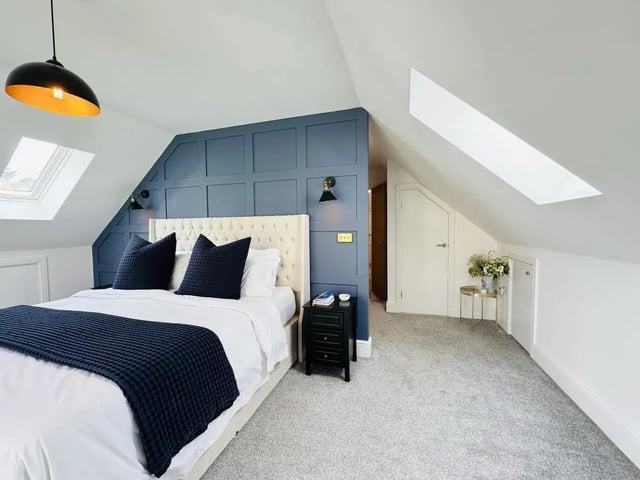 The master bedroom is a stunning open plan space but also enjoys the best views of the rear garden and woodlands through its Juliette balcony.