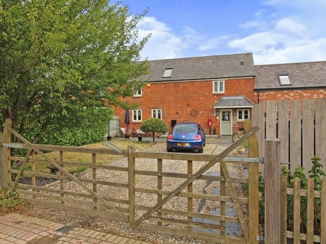 There's no doubt that, viewed from the road and through the front gate, the barn conversion is an endearing sight.