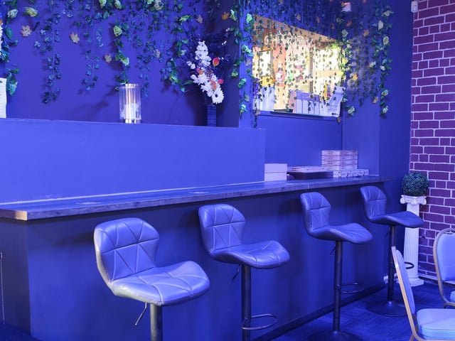 There is a postmodern vibe, combining elements of the previous social club with warm tones and updated decor.