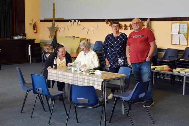 South Normanton Zion Methodist Church - chief steward Freda Ludlam showing visitors some of the old documents.