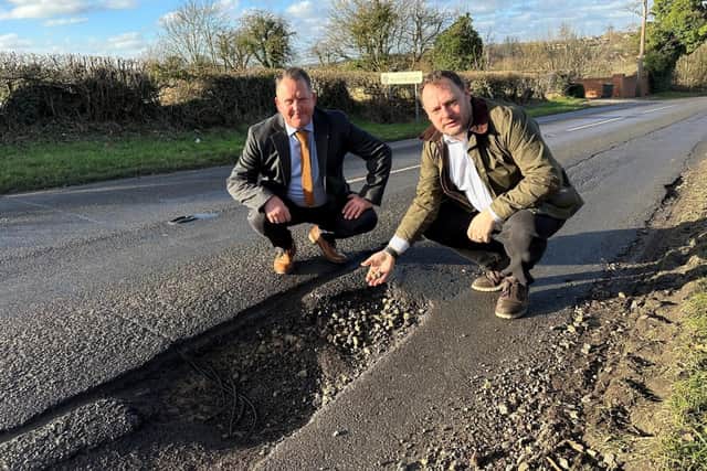 Councillors David Martin and Jason Zadrozny at the infamous Flatts Lane pot-hole