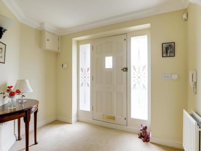 As we prepare to move up to the first floor, let's take a look at the welcoming entrance hall. It has a carpeted floor and coving to the ceiling.