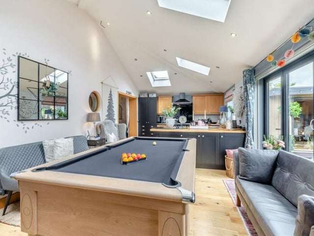This is a shot from the living space looking towards the kitchen, emphasising what a good job the current owners have made of such a bright and spacious open-plan extension.