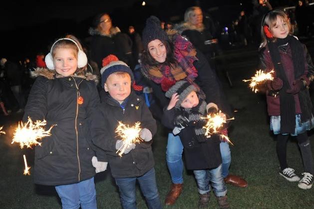 Eventgoers enjoy some classic sparkler fun ahead of the spectacular 2016 Mansfield Woodhouse fireworks display