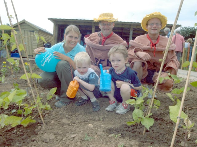 Claire Walker, leader of the Little Roots Children’s Community Allotment at Woodhouse, pictured with Dominic Hobson, and Ryan Mollatt along with Bill and Ben at the opening of the project in 2006.