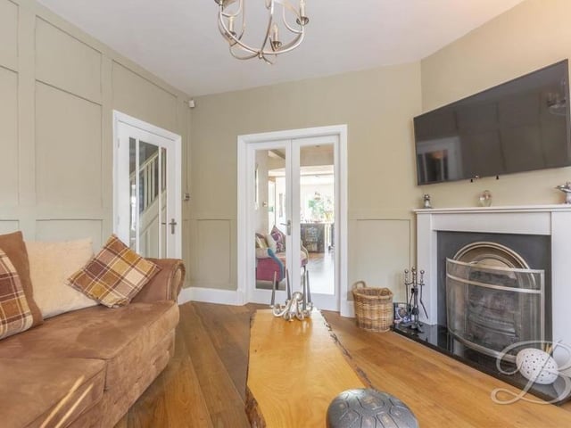 The snug is the perfect spot to relax and put your feet up in front of the fire and the big-screen TV. The double doors, which you can see in the photo, lead into the kitchen.