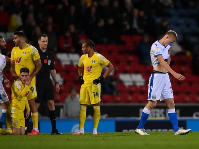 Jan Paul Van Hecke of Blackburn Rovers leaves the pitch following receiving a red card against Fulham.