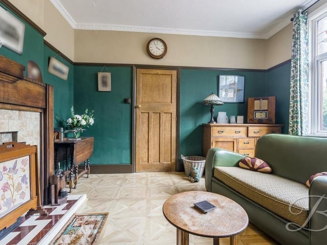 As well as the main reception room, the ground floor boasts this versatile sitting room. It's a cosy space, with a traditional fireplace and window facing the front of the property.