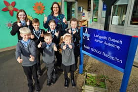 Langwth Bassett Junior Academy principal Sarah Bacon and school council members give their Ofsted report the thumbs-up.