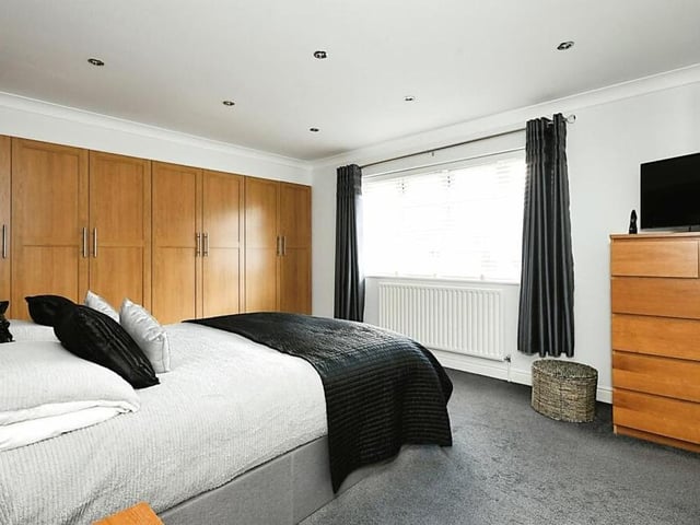 Moving upstairs, let's take a look at the four bedrooms. This is the master, which has fitted wardrobes, views overlooking the front of the property and access to an en suite bathroom.