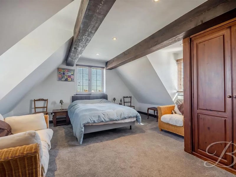 One of the stunning bedrooms complete with character beams