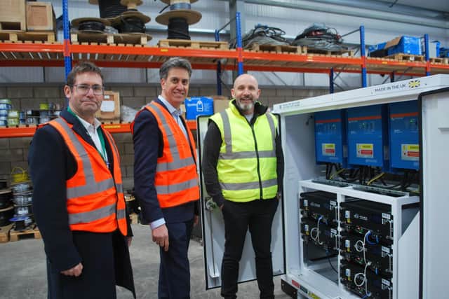 From left, Mansfield mayor Andy Abrahams, shadow climate change secretary Ed Miliband and Power Saving Solutions owner Andy Richardson on the factory floor.