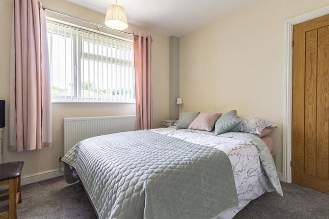 The second ground-floor double bedroom is spacious, with a window facing the front of the £459,000 bungalow.