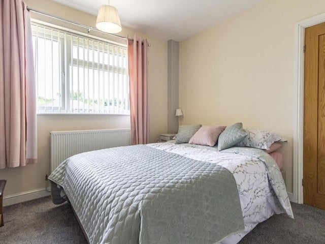 The second ground-floor double bedroom is spacious, with a window facing the front of the £459,000 bungalow.