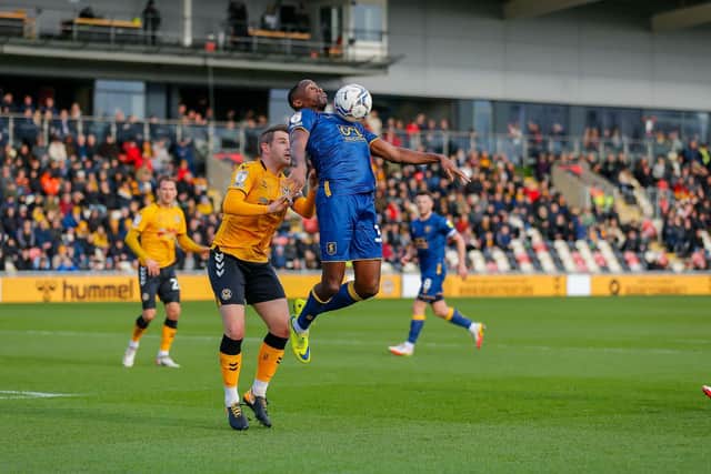 Mansfield Town forward Lucas Akins holds the ball up superbly at Newport. Photo by Chris Holloway/The Bigger Picture.media