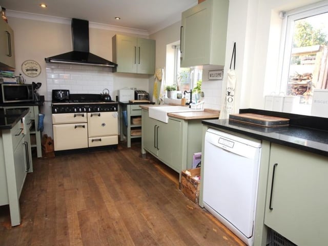 This is our first look at the open-plan dining kitchen, which runs across the back of the £400,000-plus property. It is fitted with a range of matching wall and base units, and has space for a Rangemaster cooker with extractor over. Granite work surfaces incorporate a country-style sink.