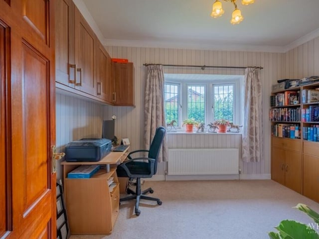 This bedroom is currently being used as a study. It could also be converted into a home office.