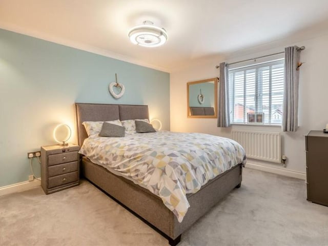 The first of the four bedrooms on the first floor to look at is the master, which is a good-sized double. It faces the front of the property, and has fitted wardrobes and access to an en suite shower room.