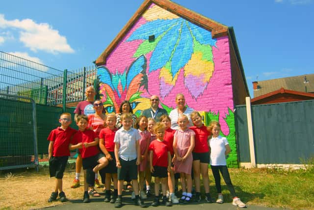 Year 2 pupils from Brigg Infant School with (back left to right) artists Dave Elsom and Lucie Maycock, with Councillor Donna Hales, deputy leader of Bolsover District Council, Dan Oakley, district council community arts development officer, and Bolsover district and South Normanton parish councillor Emma Stevenson. Credit: Junction Arts