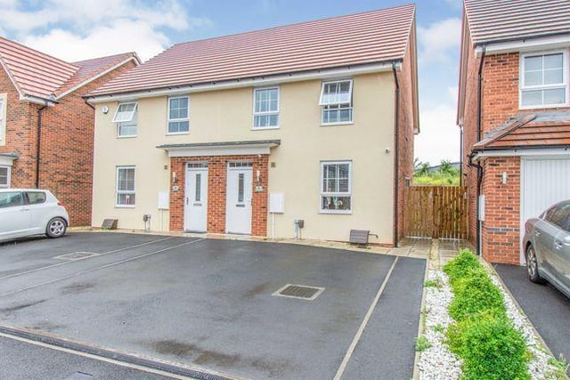 This three bedroom house has a modern kitchen diner with grey units and an area patioed in the garden for a hot tub. Marketed by William H Brown, 01302 378046.