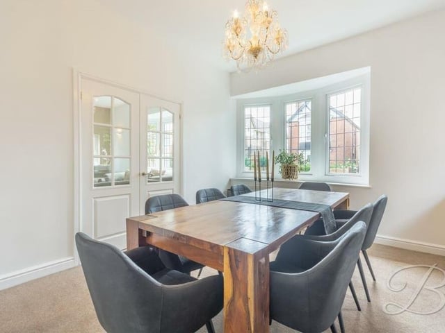 Next to the living room is this compact but pleasant dining room, which also boasts a bay window facing the front of the house.