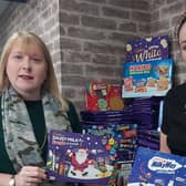 Manager Alanya Jennings (right) and owner Hayley Wood with some of the selection boxes that were donated for the Christmas appeal at the Wood's Of Westgate hair and beauty salon last year. (PHOTO: Submitted)