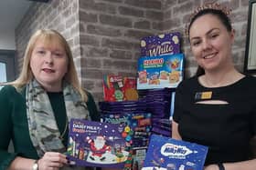 Manager Alanya Jennings (right) and owner Hayley Wood with some of the selection boxes that were donated for the Christmas appeal at the Wood's Of Westgate hair and beauty salon last year. (PHOTO: Submitted)