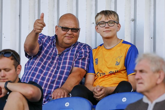 Mansfield fans watch the Carabao Cup first round match against Derby County FC at the One Call Stadium
Photo Credit Chris HOLLOWAY / The Bigger Picture.media:https://www.chad.co.uk/sport/football/mansfield-town