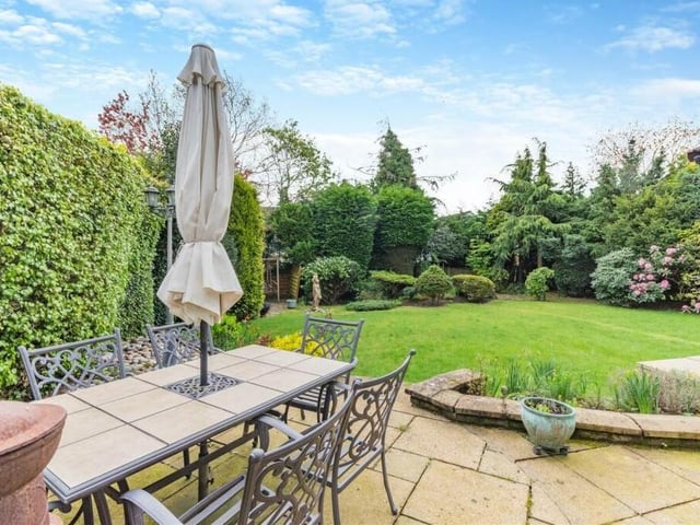The private and enclosed south-facing rear garden is a sight for sore eyes, whatever the weather. It features a central lawn, well-stocked borders and mature shrubs and trees.
