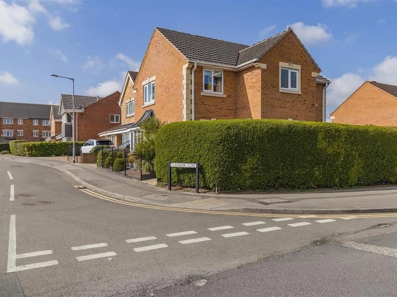 A modern four bedroom detached family house built in 2009 occupying a corner plot with a single garage and west facing rear garden.