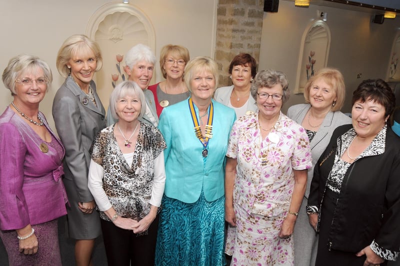 Judi Parkinson, fifth right, President of the Inner Wheel Club of Kirkby in Ashfield, is pictured with officers and guests at one of the club's charter lunches in 2010.