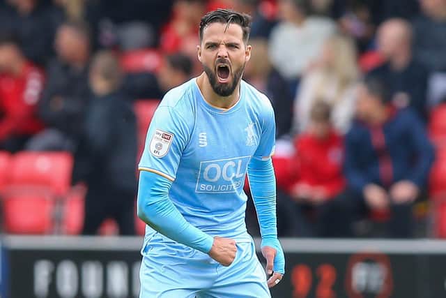 Mansfield Town defender Stephen McLaughlin rallies the team.