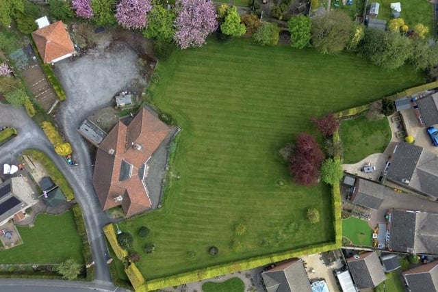 This aerial view from a drone underlines the size of the plot of land that Jasper Lodge sits on. It affords the property exciting potential for extensions, subject to planning permission,