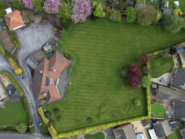 This aerial view from a drone underlines the size of the plot of land that Jasper Lodge sits on. It affords the property exciting potential for extensions, subject to planning permission,