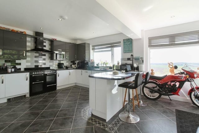 Let's begin our tour of the Sutton property in the newly-fitted, modern and stylish kitchen. There is plenty of space and a host of units and appliances.