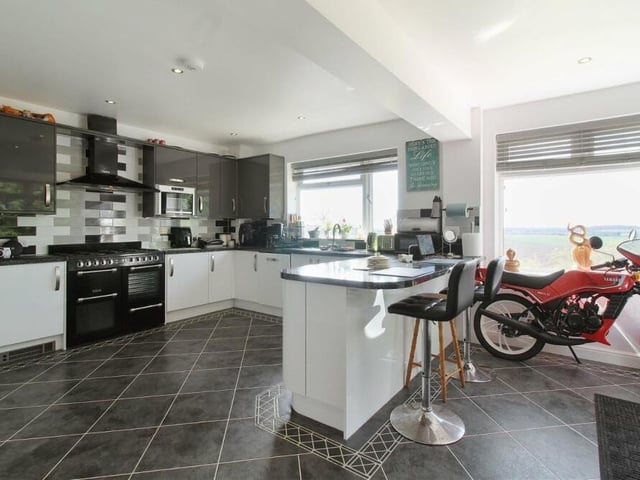 Let's begin our tour of the Sutton property in the newly-fitted, modern and stylish kitchen. There is plenty of space and a host of units and appliances.