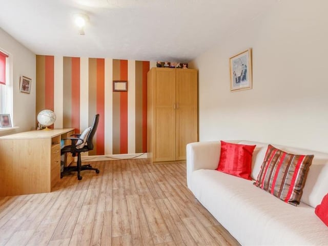 This double bedroom could easily be converted into a home office, if required. It is such a good size, there is space for a comfy sofa.
