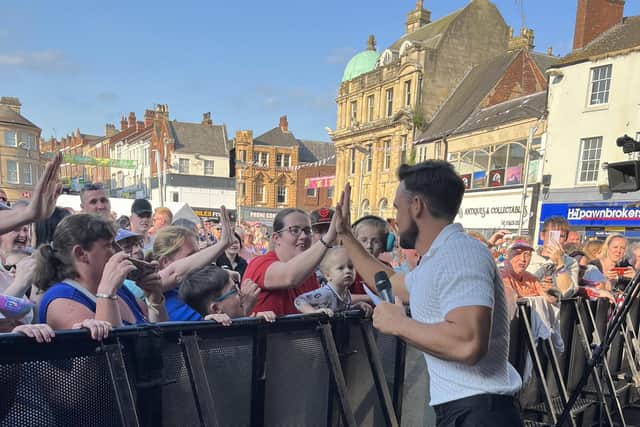 Singer Gareth Gates interacting with the crowd on stage in Mansfield Market Place.